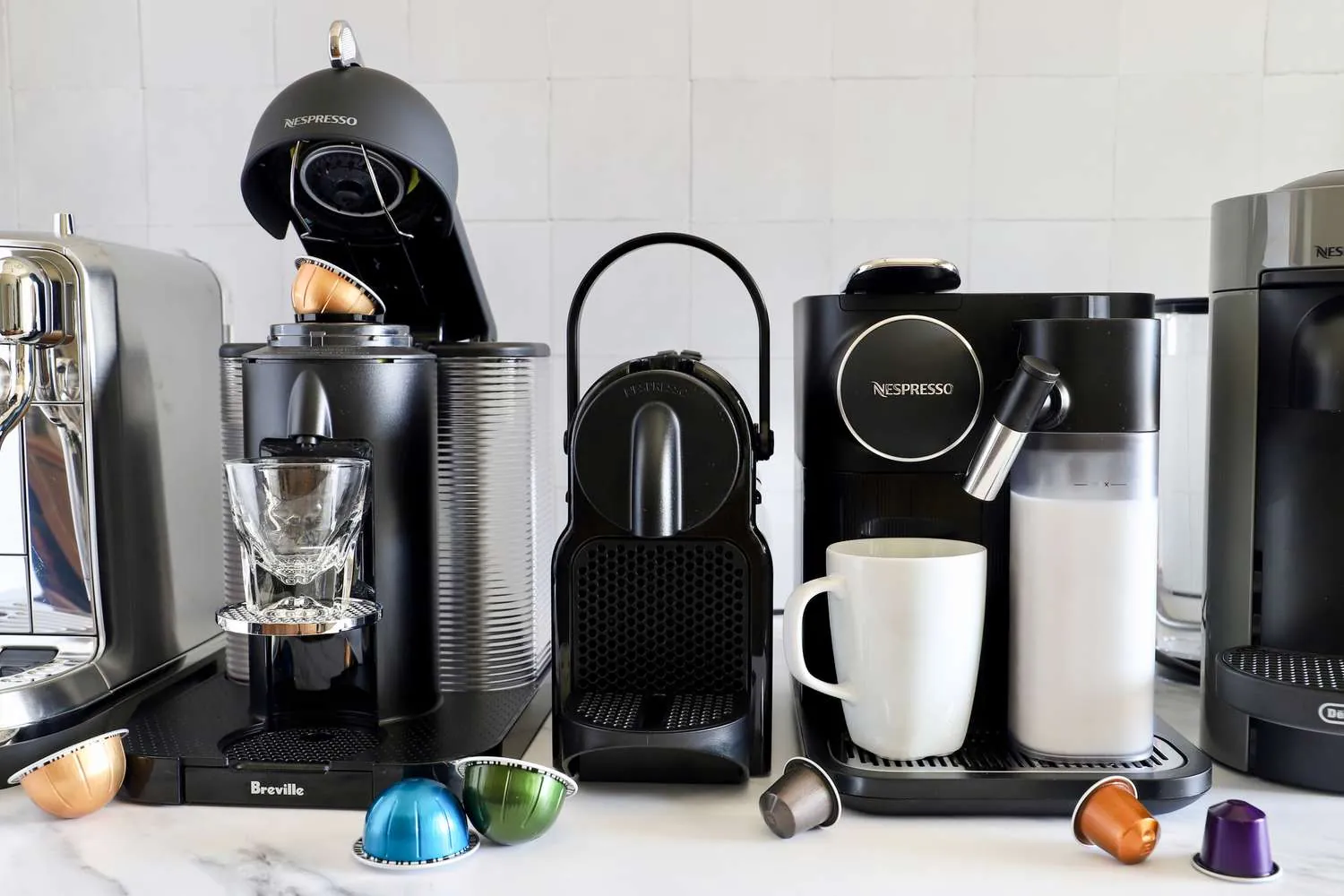 Basic and premium capsule coffee machines compared on a kitchen counter