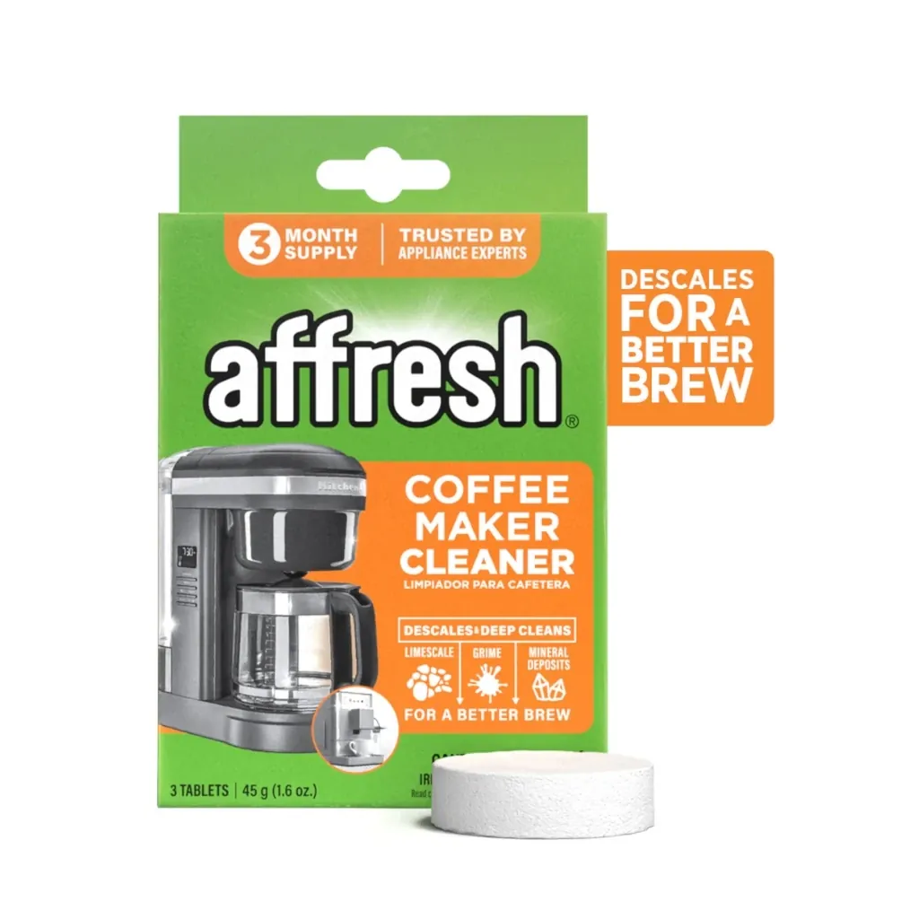Overfilled coffee maker reservoir spilling water onto the kitchen counter