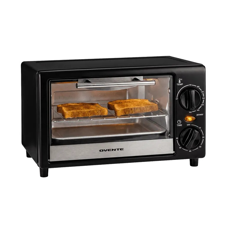 Toaster oven open beside a lemon and steaming water for cleaning